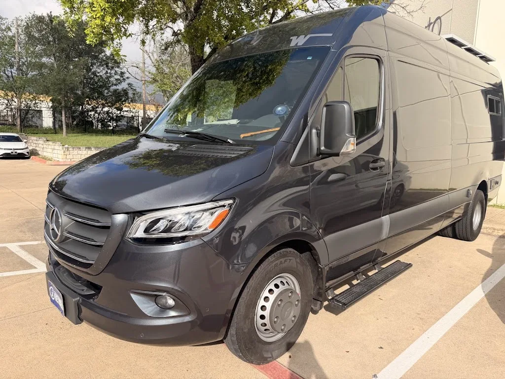 A high-roof extended Mercedes-Benz Sprinter van repaired and refinished at Luxury Auto Body in Austin