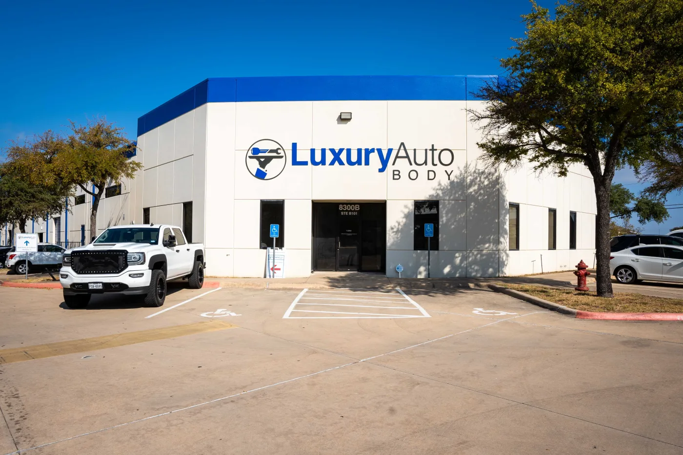 The Luxury Auto Body building exterior in Austin