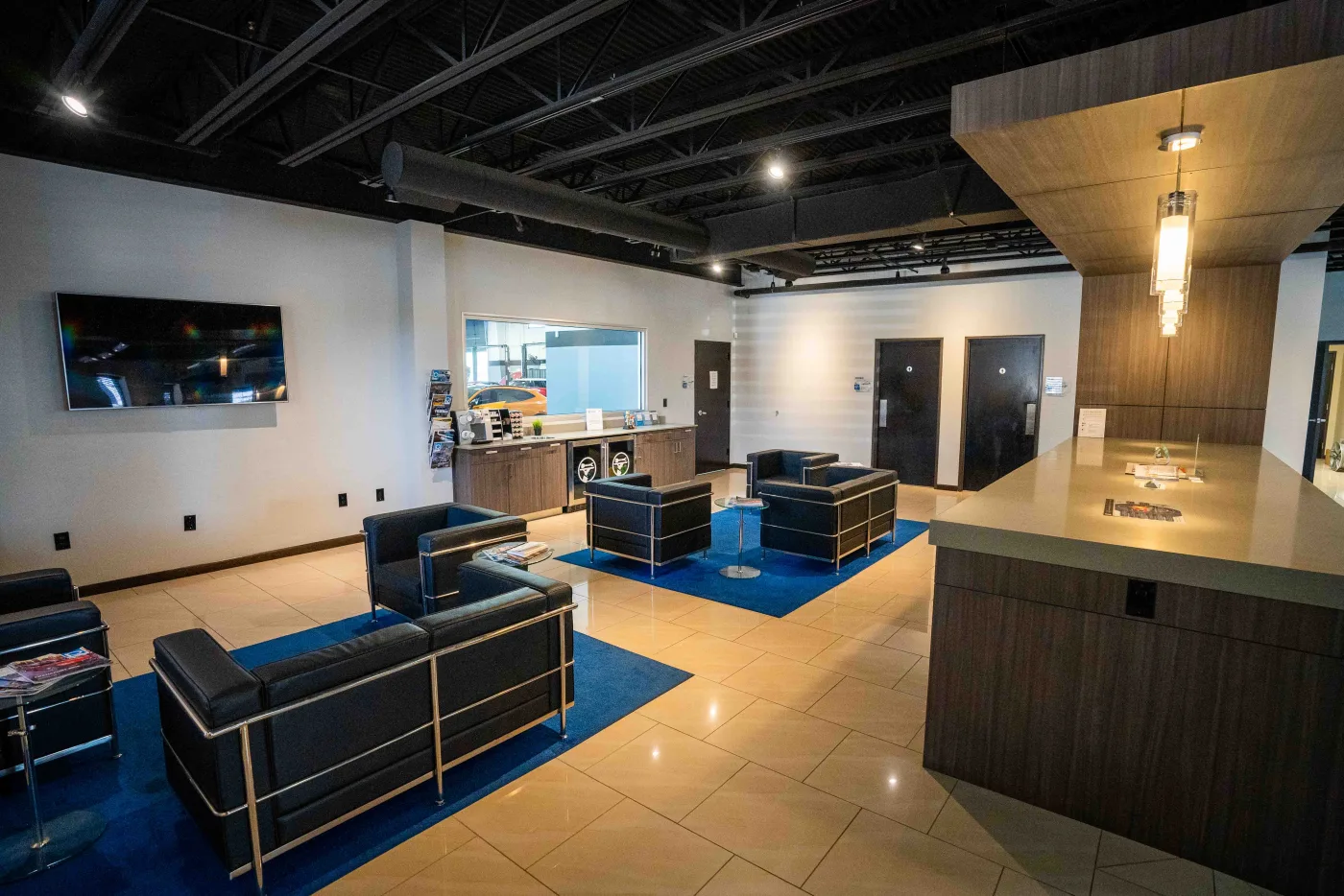 The customer waiting lounge at Luxury Auto Body in Austin